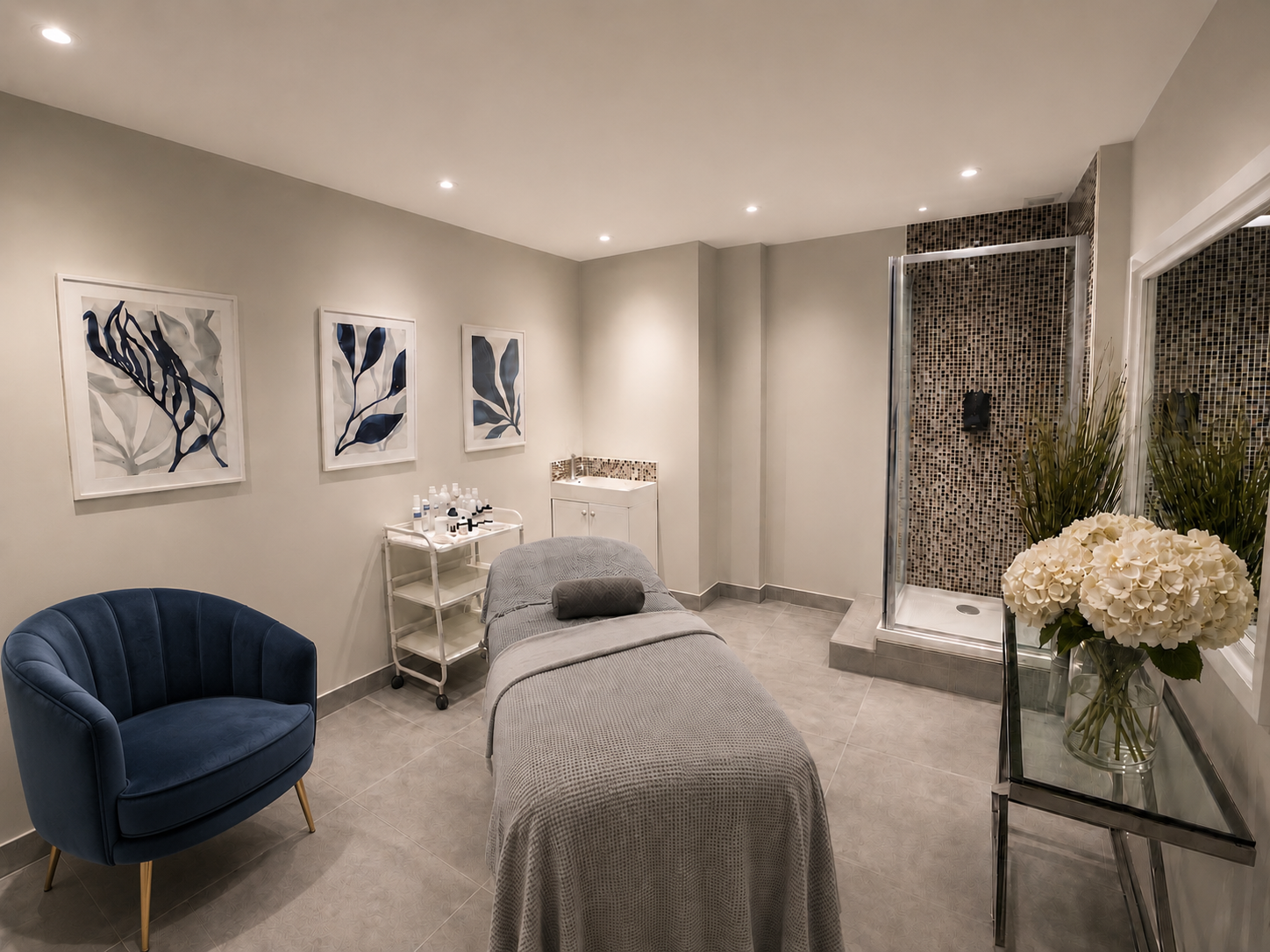Cheryl's private treatment room at Village Aesthetics in Wimbledon Village, with treatment bed, skincare trolley and mosaic shower
